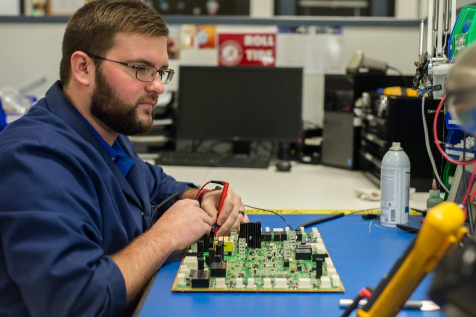 Electronic Repair Technician repairs Printed Circuit Board