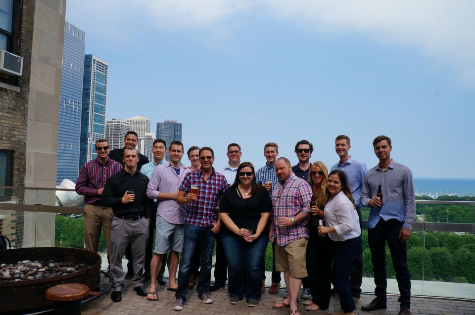 Freshly hired employees celebrate their new jobs at UpRight with a company happy hour.