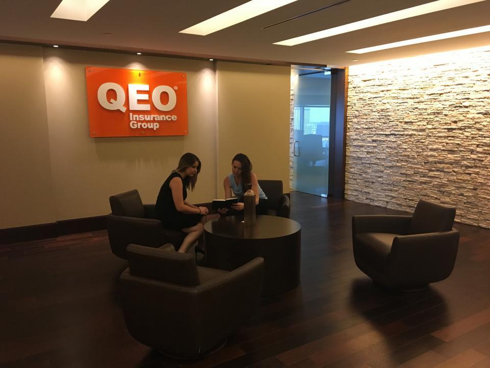 Members of the QEO management team preparing for an all-company gathering.