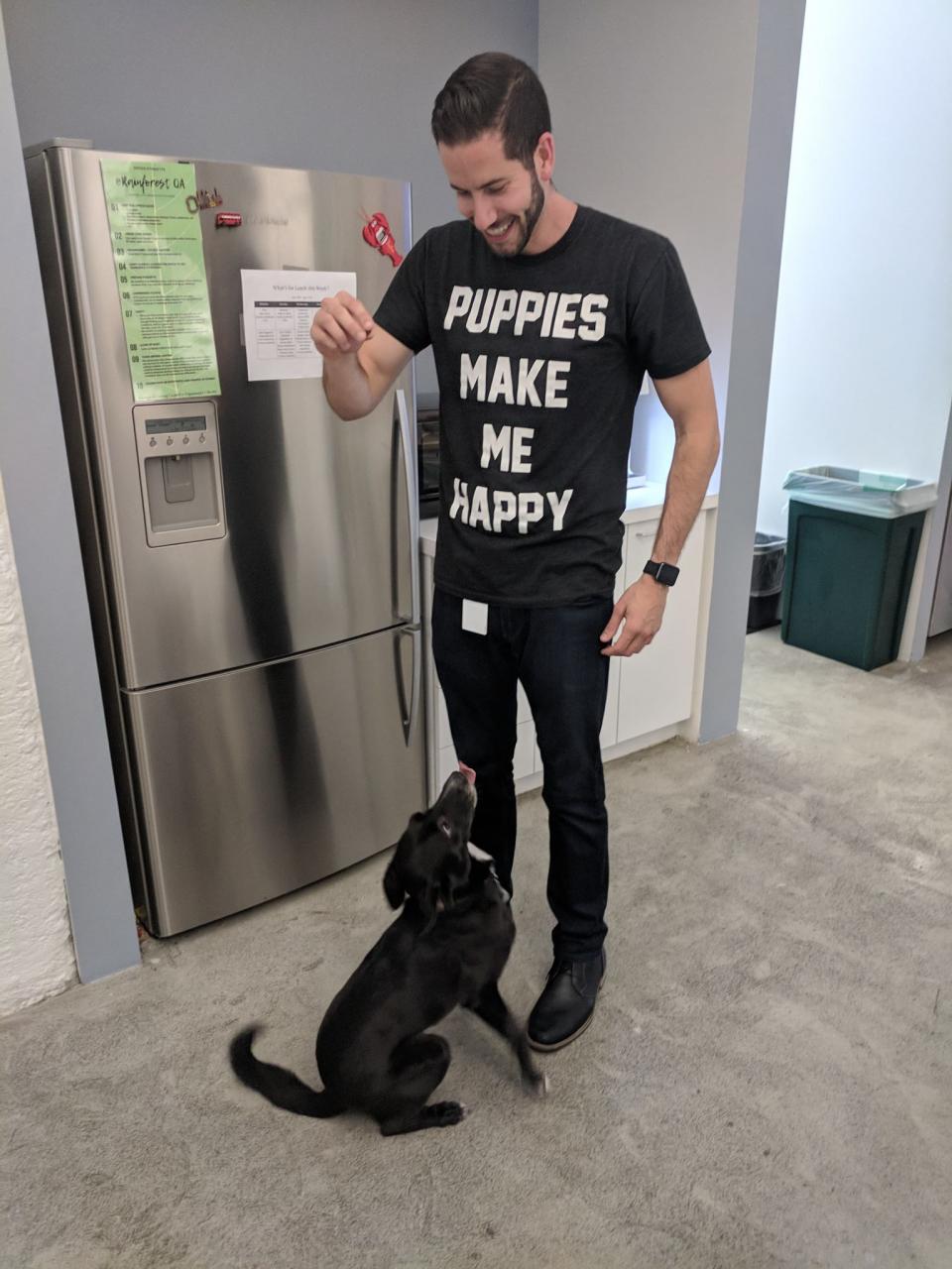 One of our employees with one of our office pups