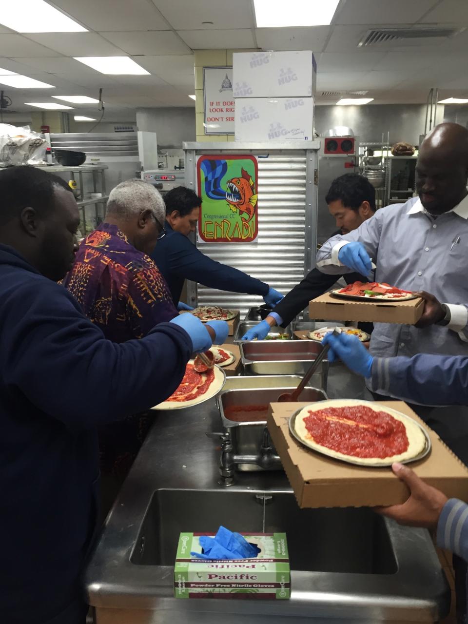 Team Making Pizzas at Orientation