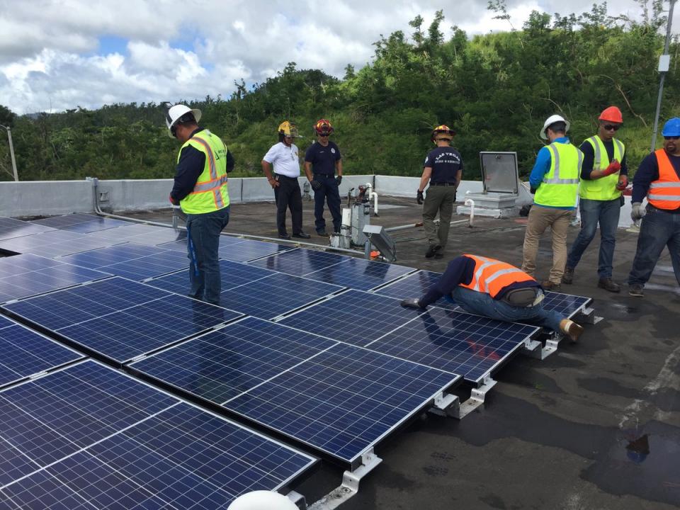 Sunrun Installation crew admires their work on a completed installation.