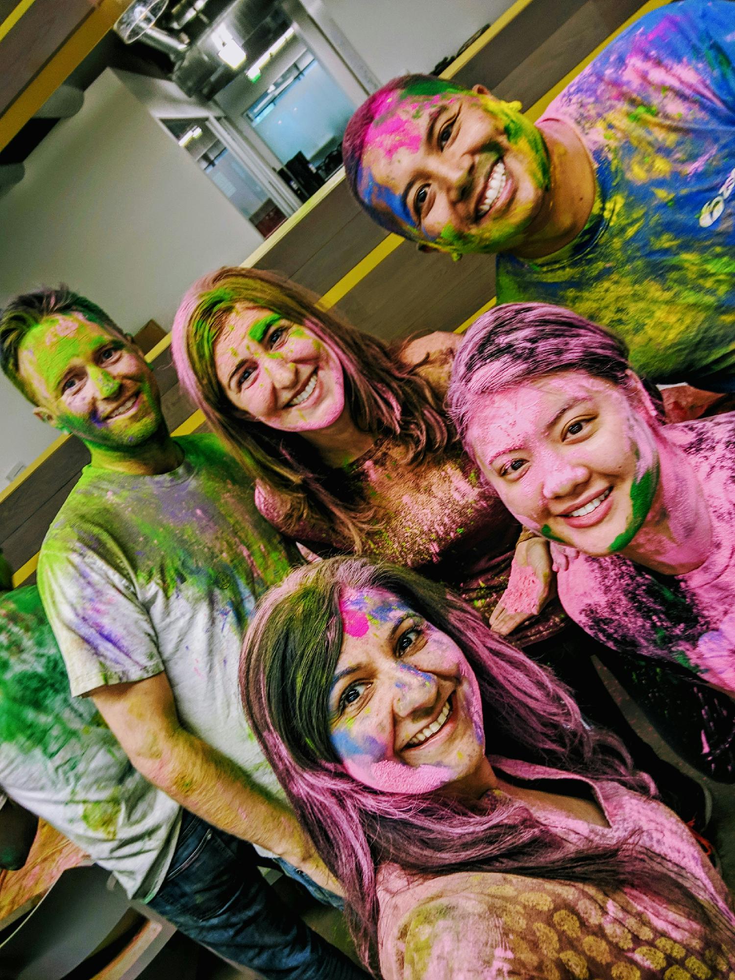 The team has fun celebrating Holi, a festival of colors. 