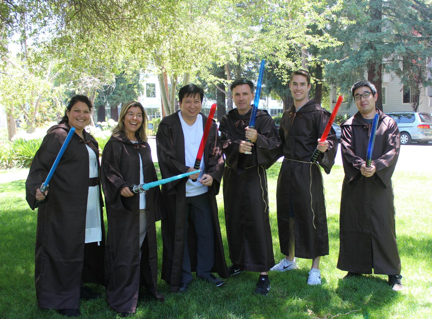 The team grabs their lightsabers for a scavenger hunt event. 