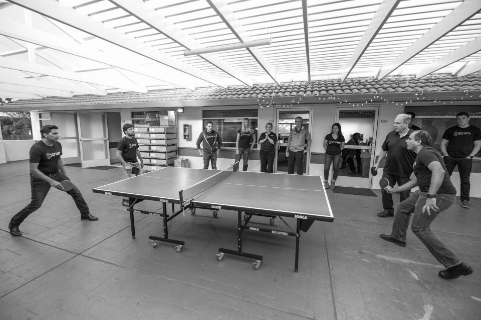 Striim members playing ping pong