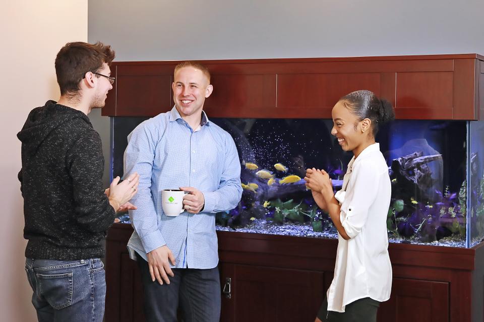 Employees take a break and chat in the TPP Cafe.