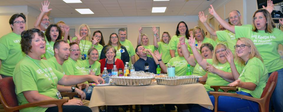 Team members raise money for flowers for residents.