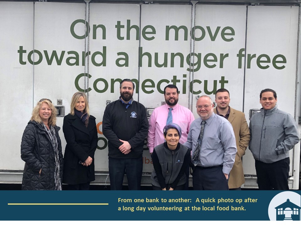 From one bank to another:  A quick photo op after a long day volunteering at the local food bank.