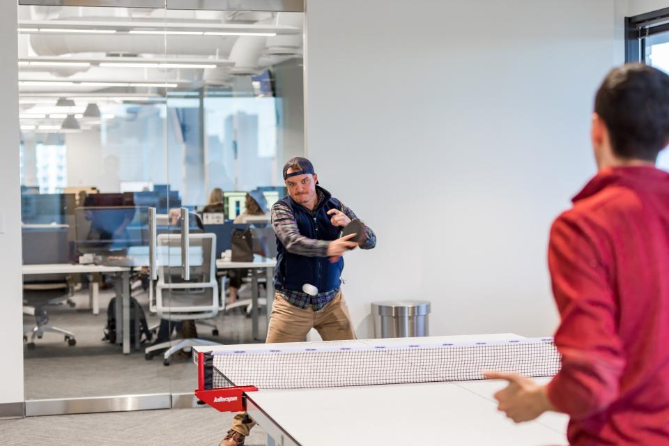 Squeezing in a quick game of ping pong!