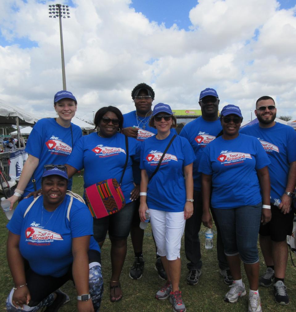 Community Care Plan distributes backpacks for Junior Achievement of South Florida's 