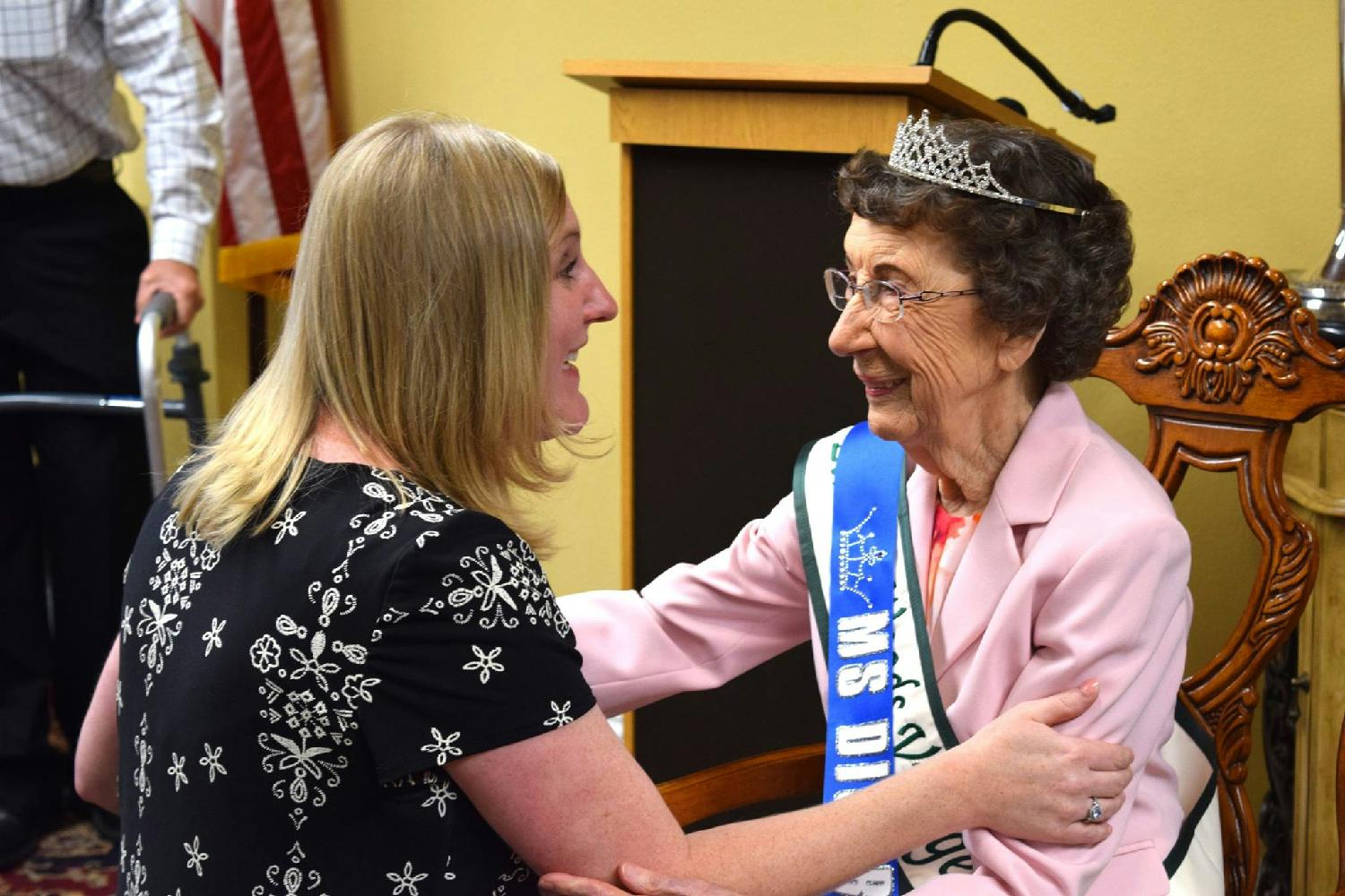 Danytra, an executive director, congratulates a resident who won a pageant! 