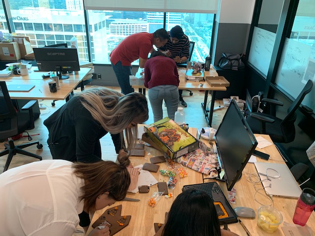 Halloween Gingerbread Challenge
Gingerbread kits were provided to three teams of three.  Each team was given 30 minutes to construct the best Halloween gingerbread house.  The focus of the event was on team-building, communication and collaboration.  The winning Halloween Gingerbread House was then placed on display as part of our company's entry in the WeWork offices as part of the Best Halloween Door Contest.