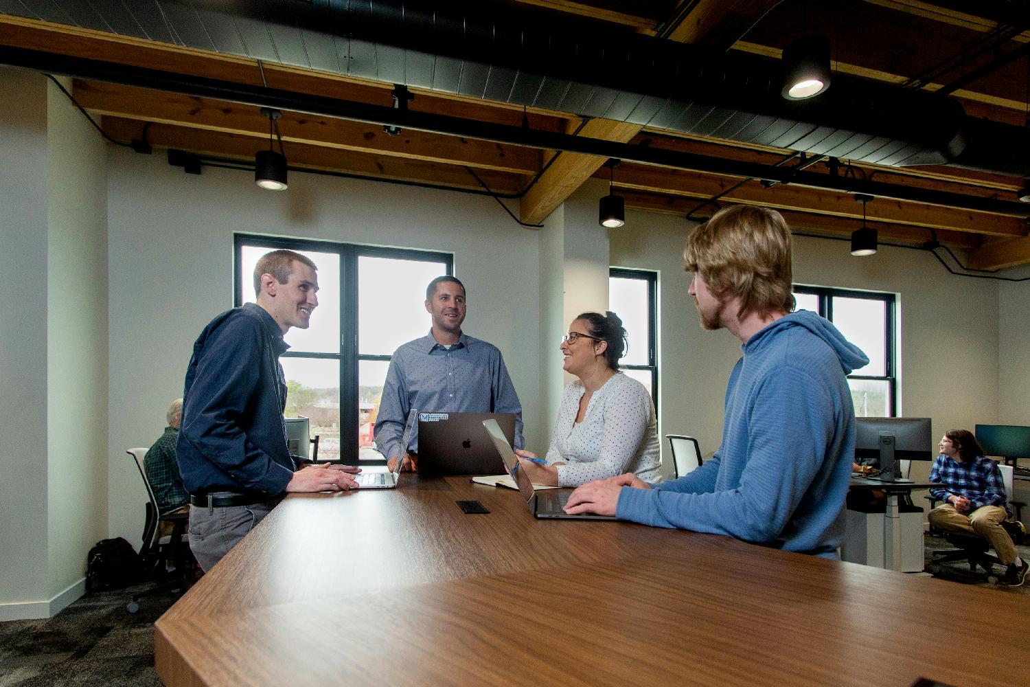 Team members hanging out in our new office during a community event.