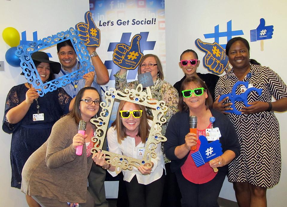 Employees pose with props celebrating #NorthBay during Employee Appreciation Meals.