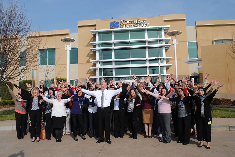 NorthBay Healthcare President and CEO Gary Passama celebrates during a videotaping with employees at NorthBay's Green Valley Administration Center.